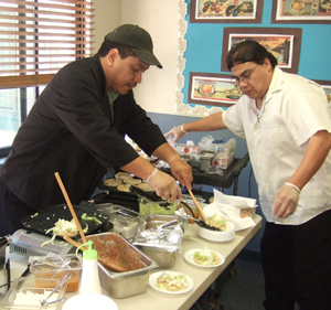 Kitchen managers and staff makes food for meals and for festivals